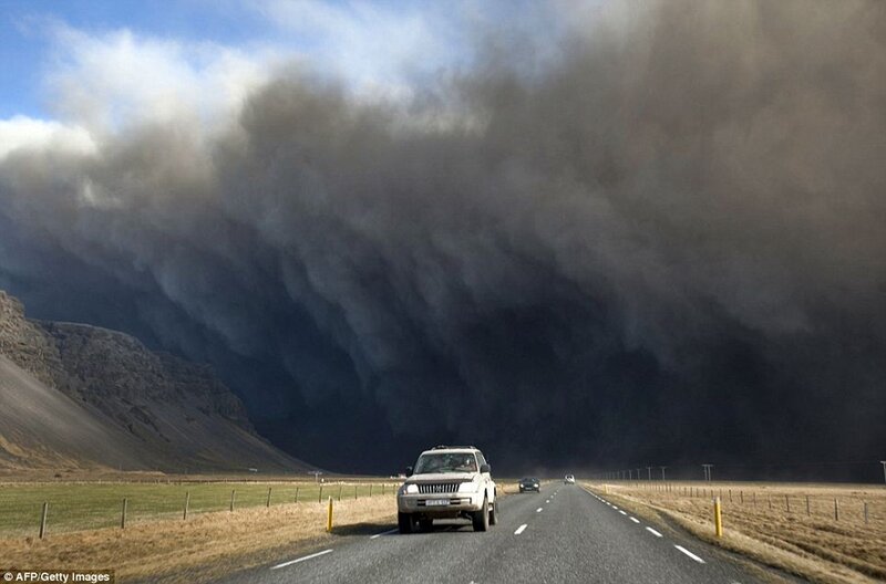 Volcanic ash cloud over road