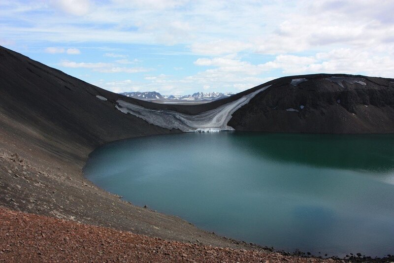 Volcanic crater lake with ice