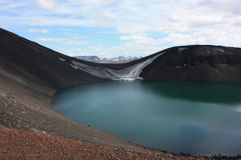 Volcanic crater lake with ice