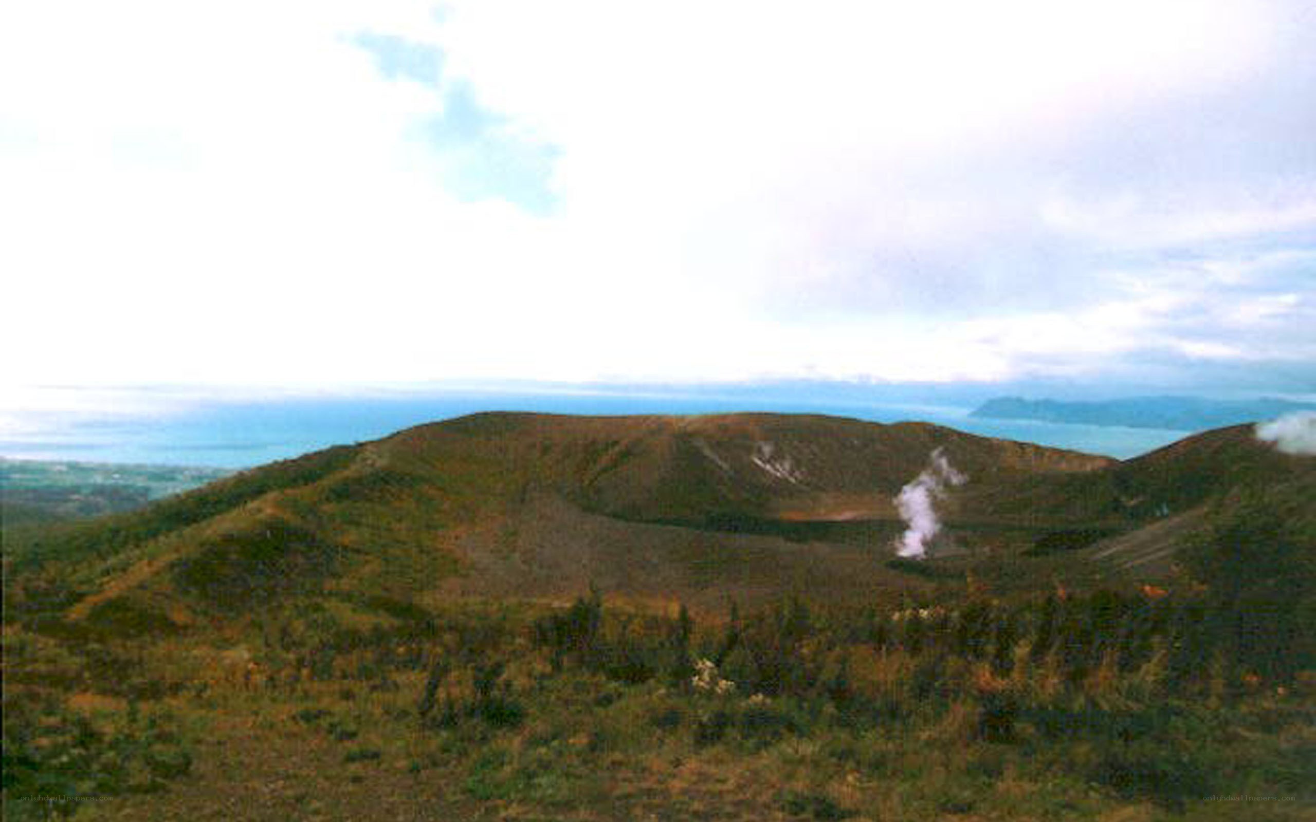 volcanic crater with steam
