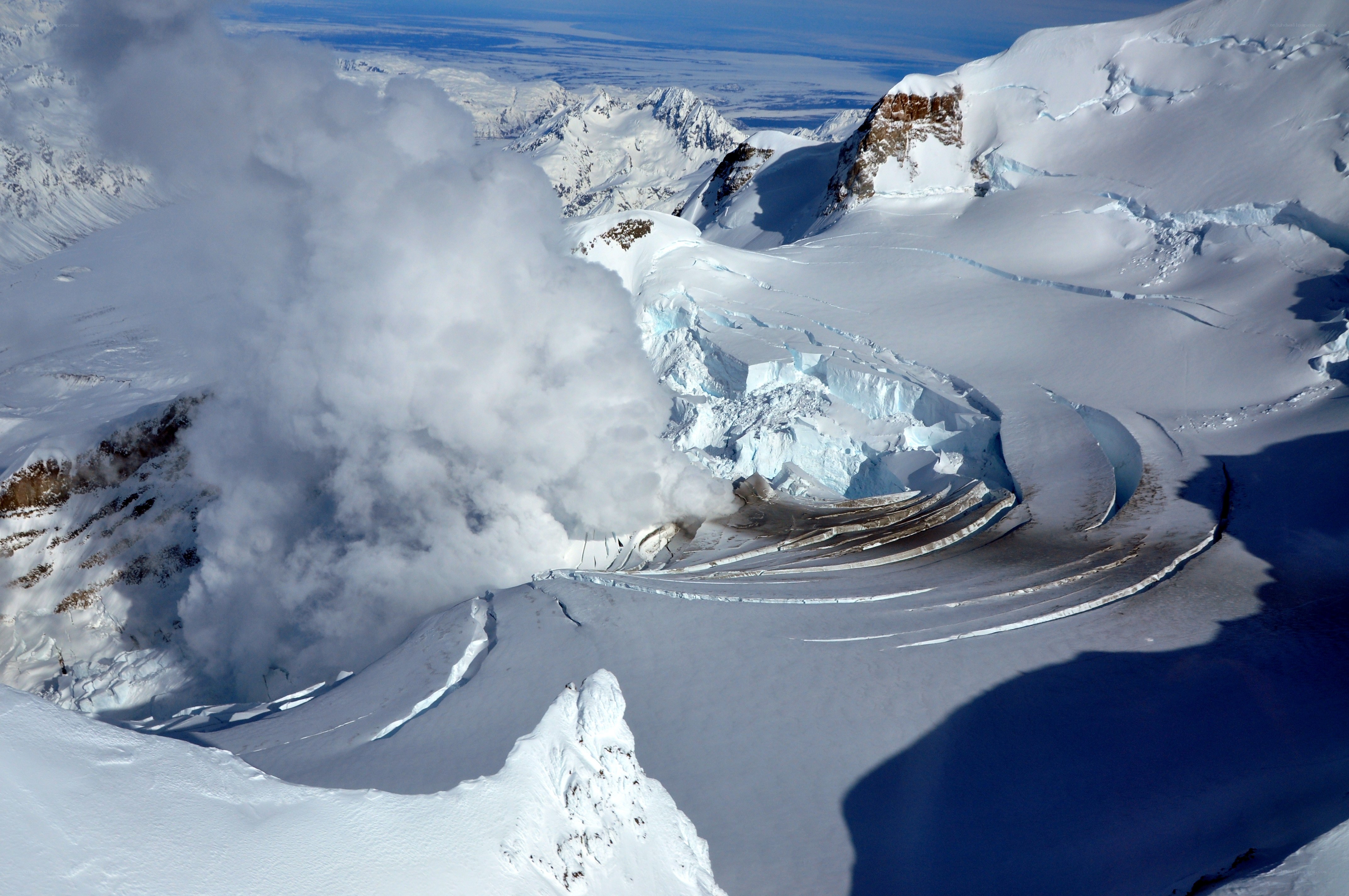 Volcanic eruption on snowy mountain