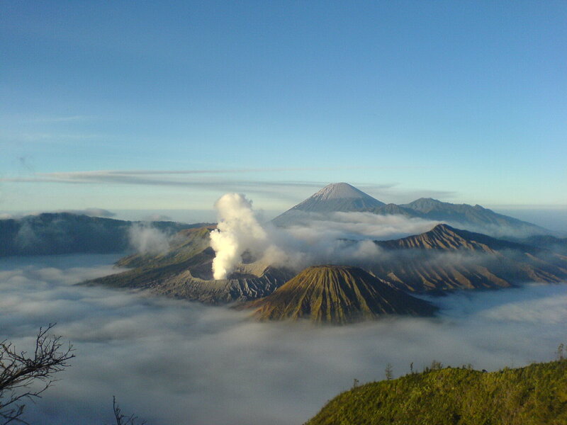 Volcanic eruption over clouds