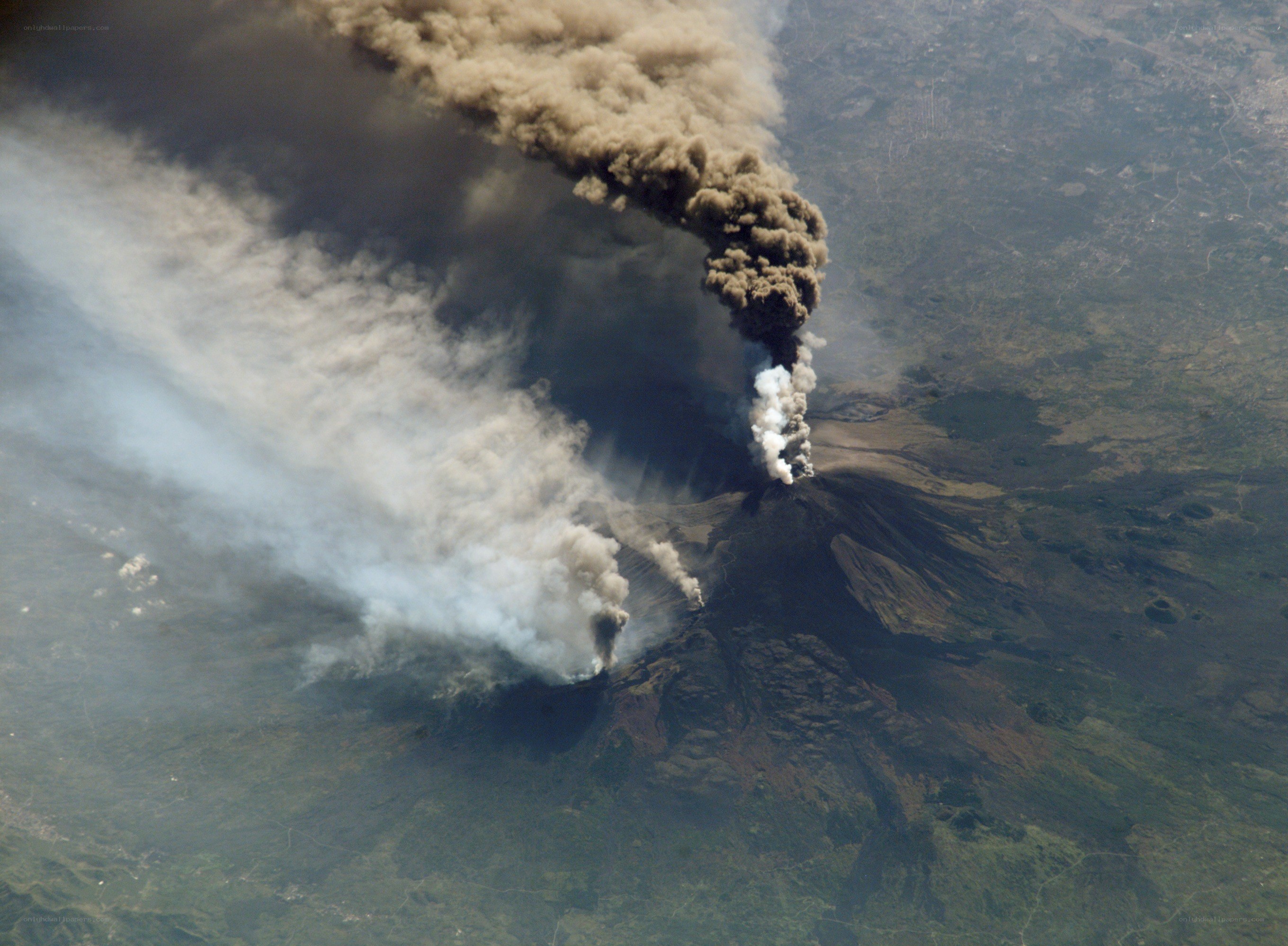 Volcanic eruption with ash plume
