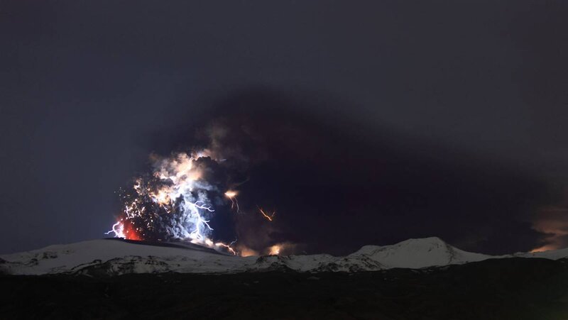 Volcanic Eruption with Lightning — Black, Dramatic, Night, Photograph, Ash Cloud, Snow-covered Mountains, White, Gray