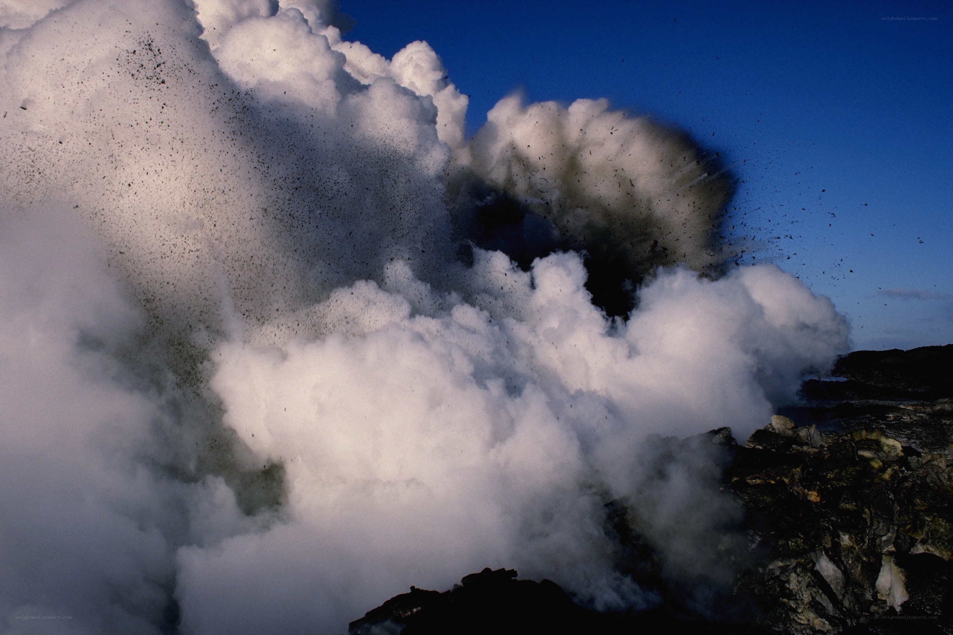 Volcanic eruption with steam and ash
