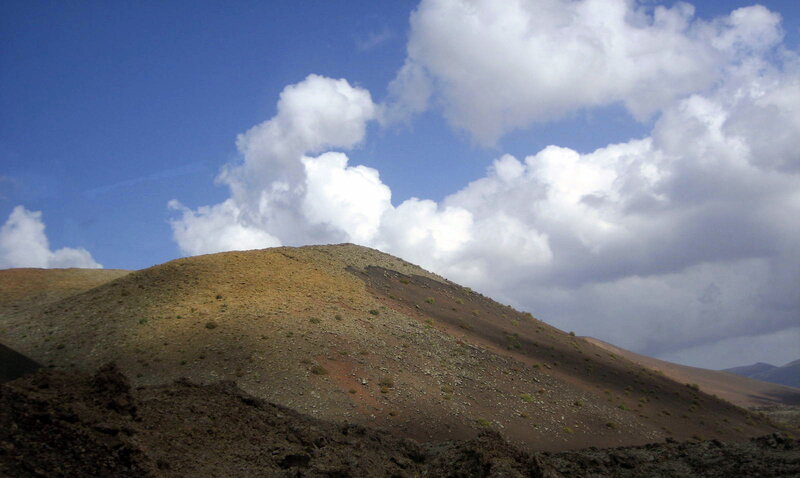 Volcanic Hill under Clouds — Blue
