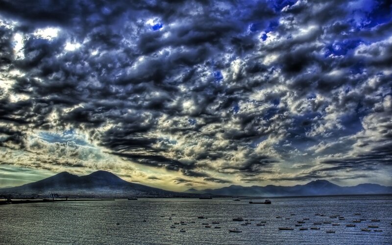 Volcanic Island in Sea — Blue, Dramatic