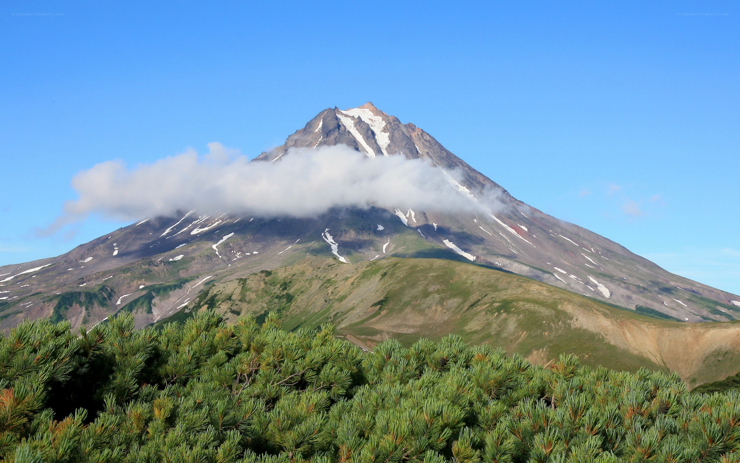 Volcanic mountain with clouds