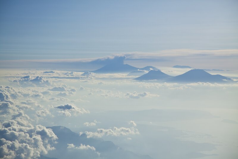 Volcanic Mountains Above Clouds