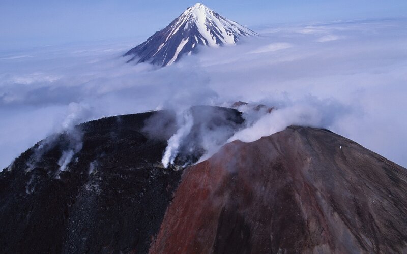 Volcanic peaks above clouds