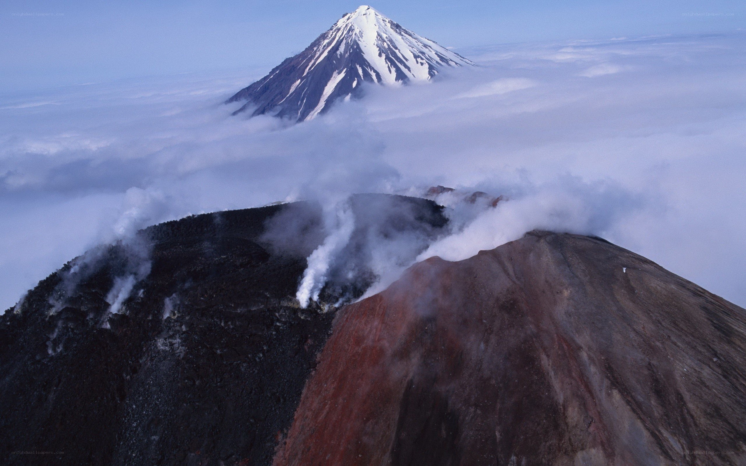 Volcanic peaks above clouds