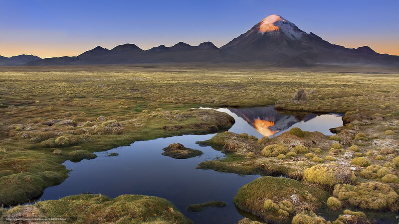 Volcano at sunrise with reflection