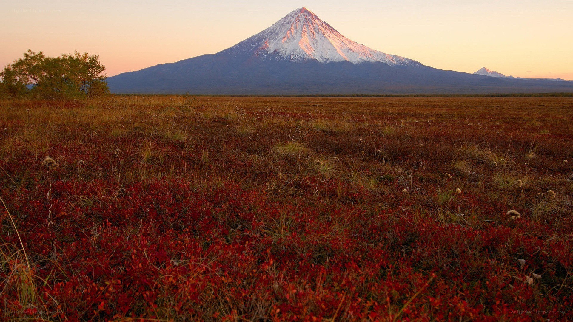 Volcano at sunset in tundra