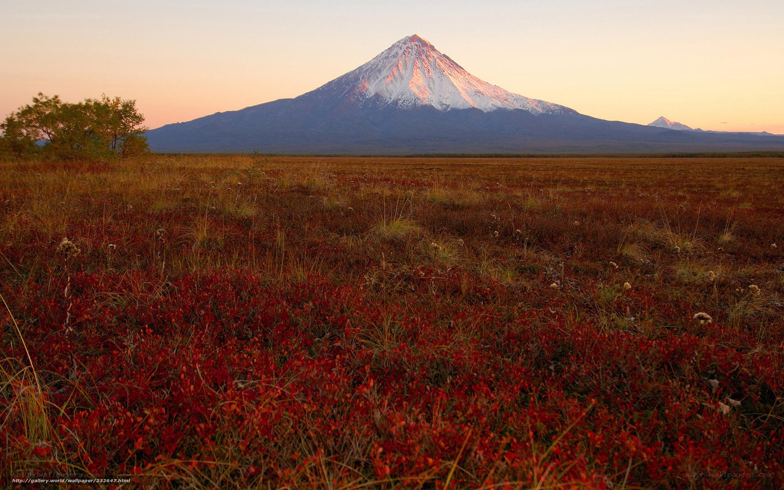 Volcano at sunset in tundra