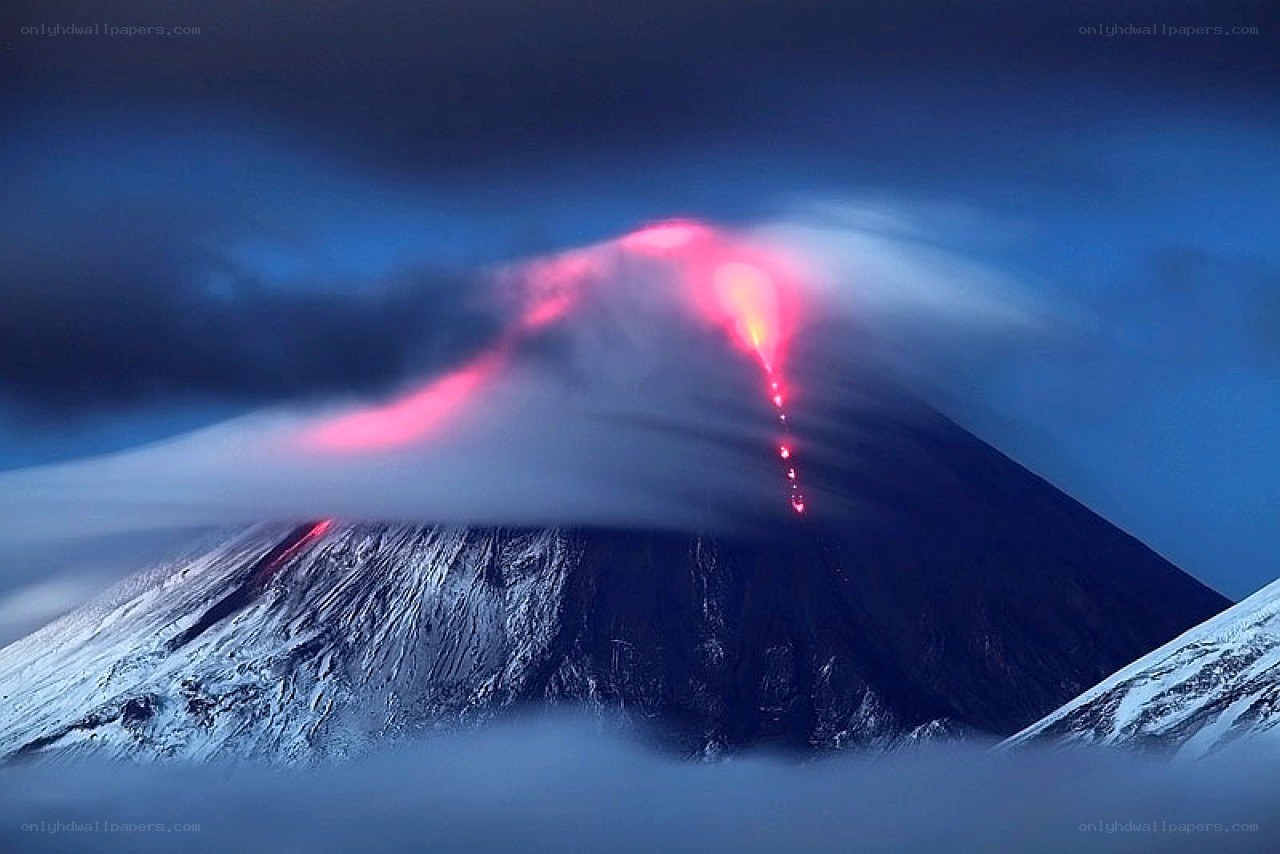 Volcano erupting at dusk