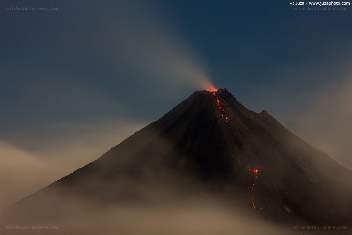 Volcano erupting at dusk