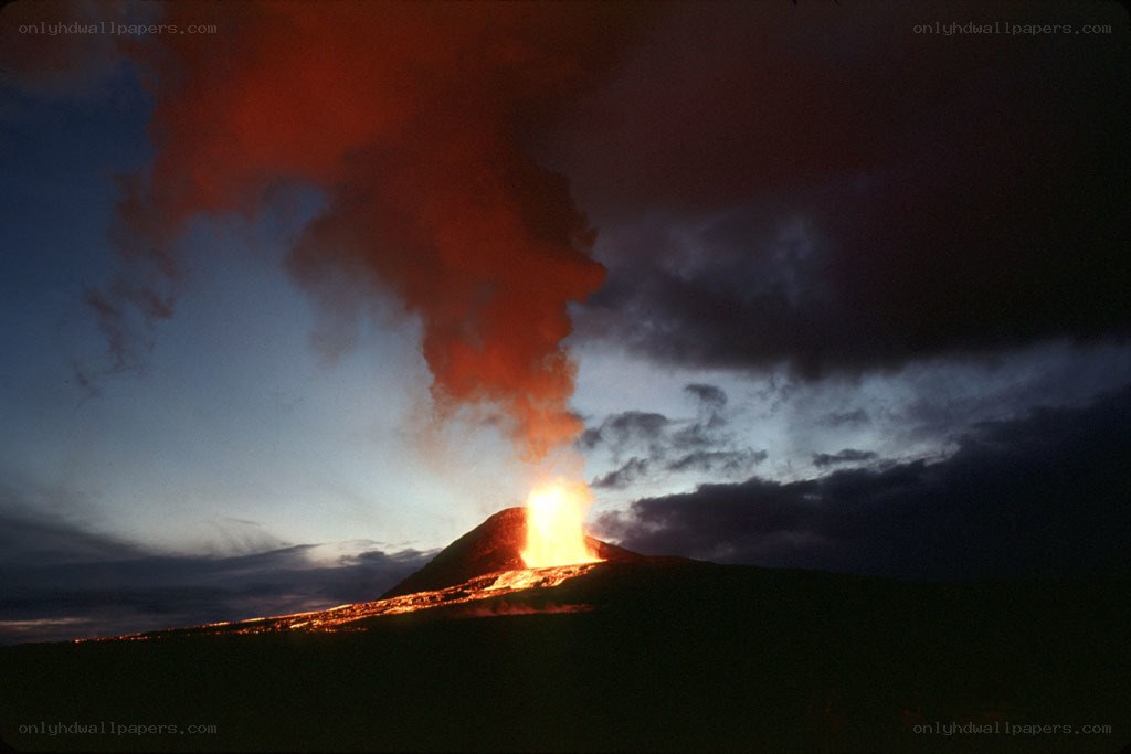 Volcano erupting at dusk