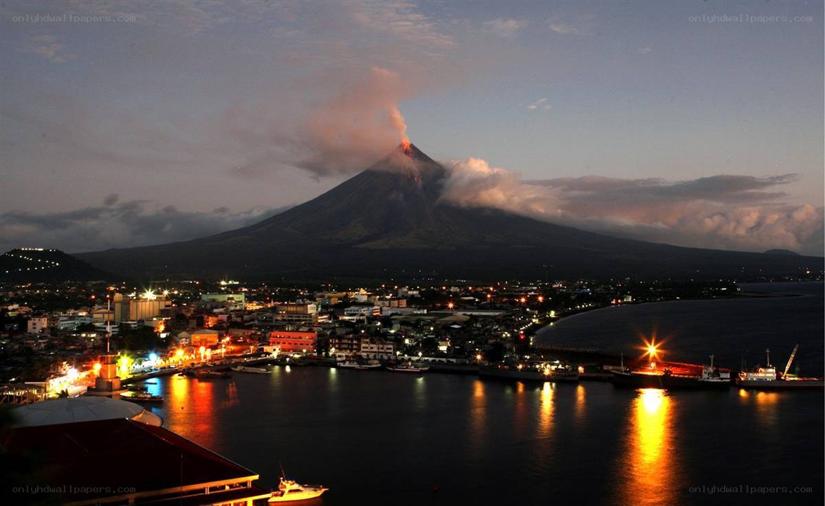 Volcano erupting at dusk