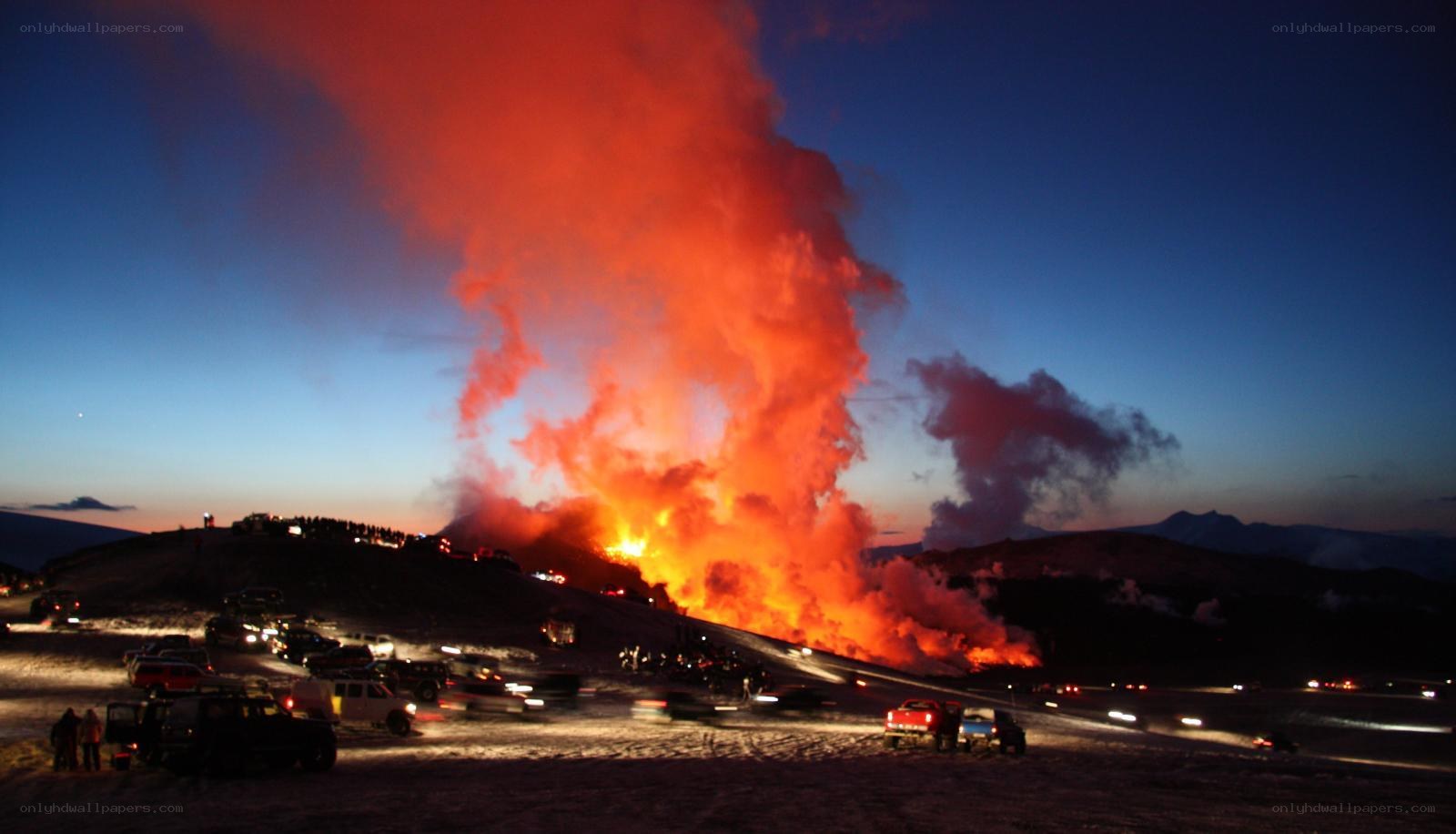 Volcano erupting at dusk