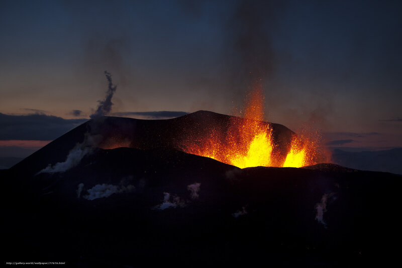 Volcano erupting at dusk