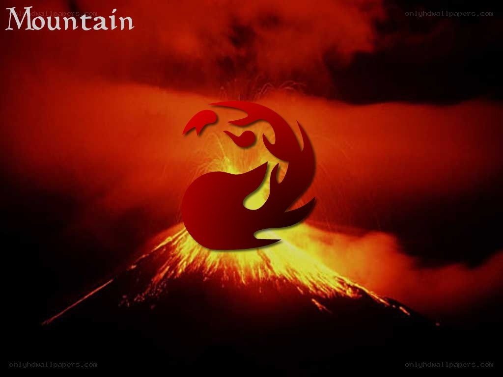 volcano erupting at night