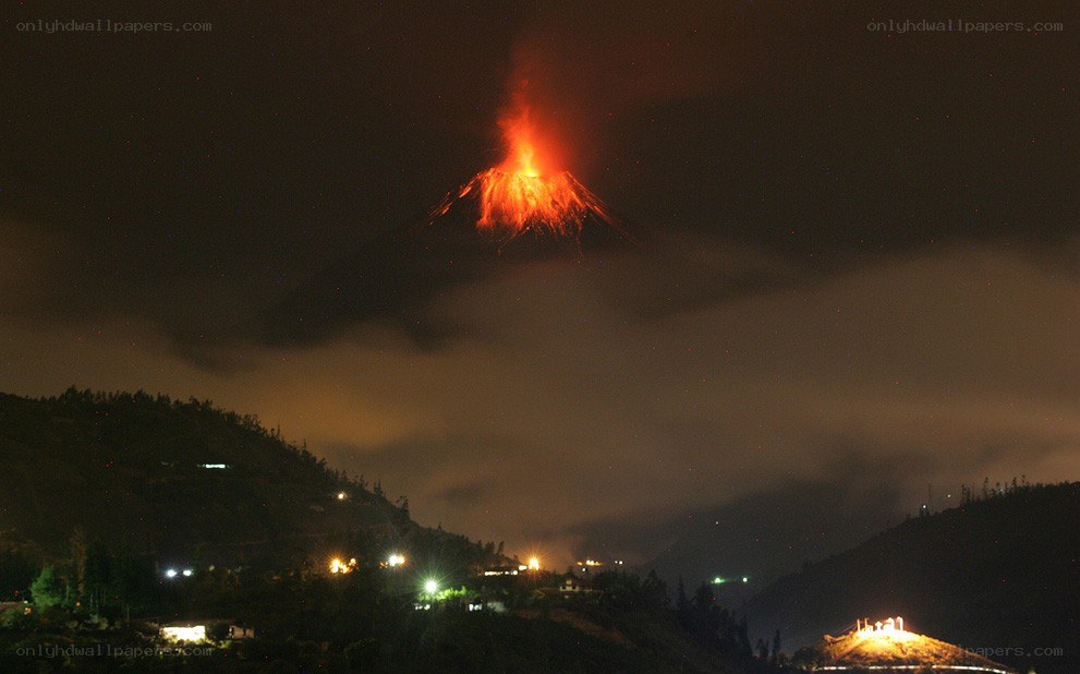 Volcano erupting at night