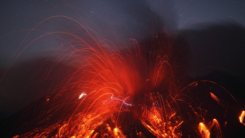 Volcano erupting at night