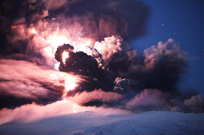 Volcano erupting at night