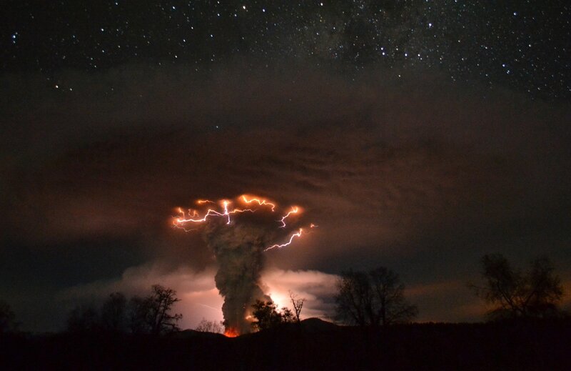 Volcano erupting at night
