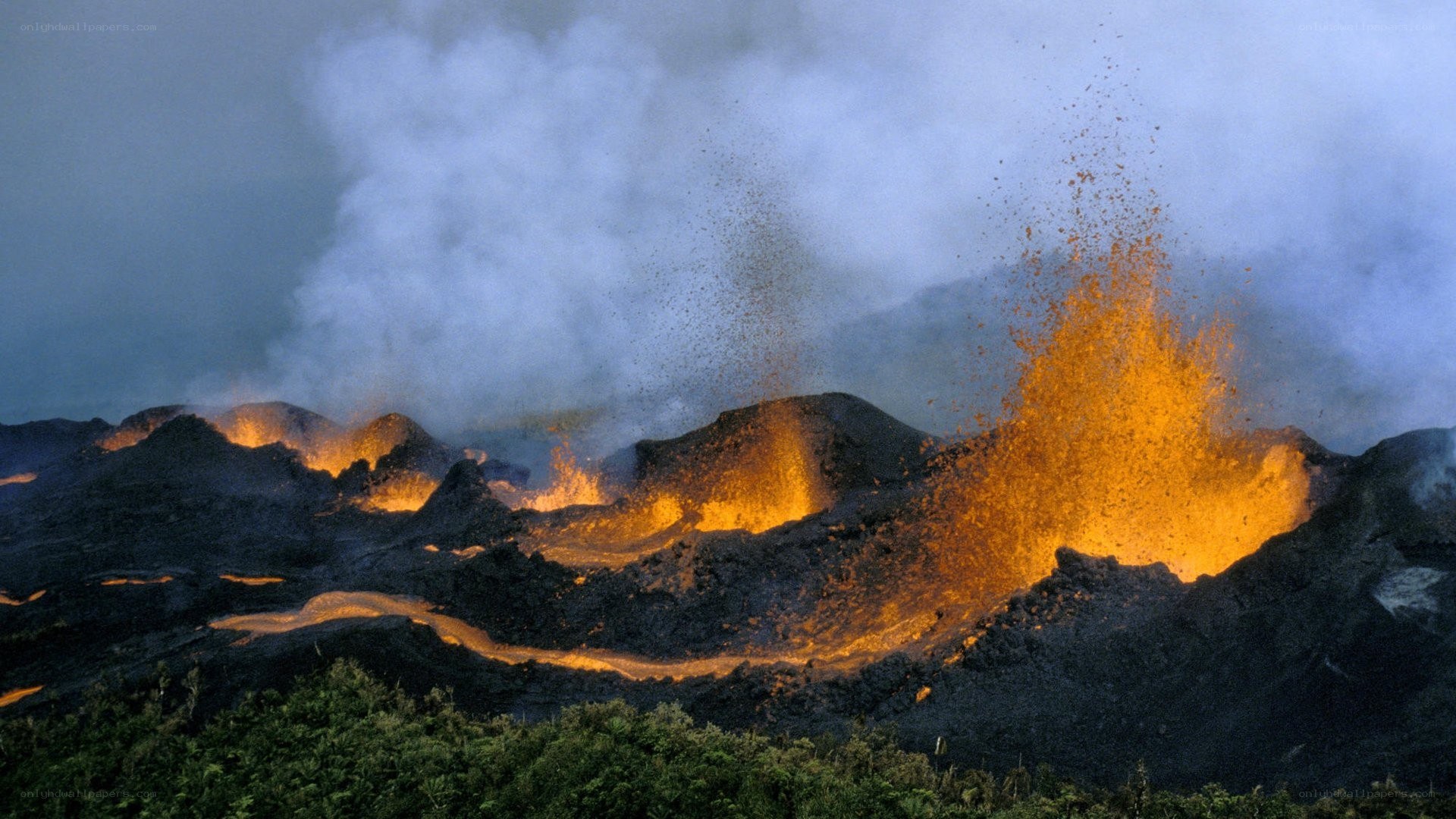 Volcano erupting at night