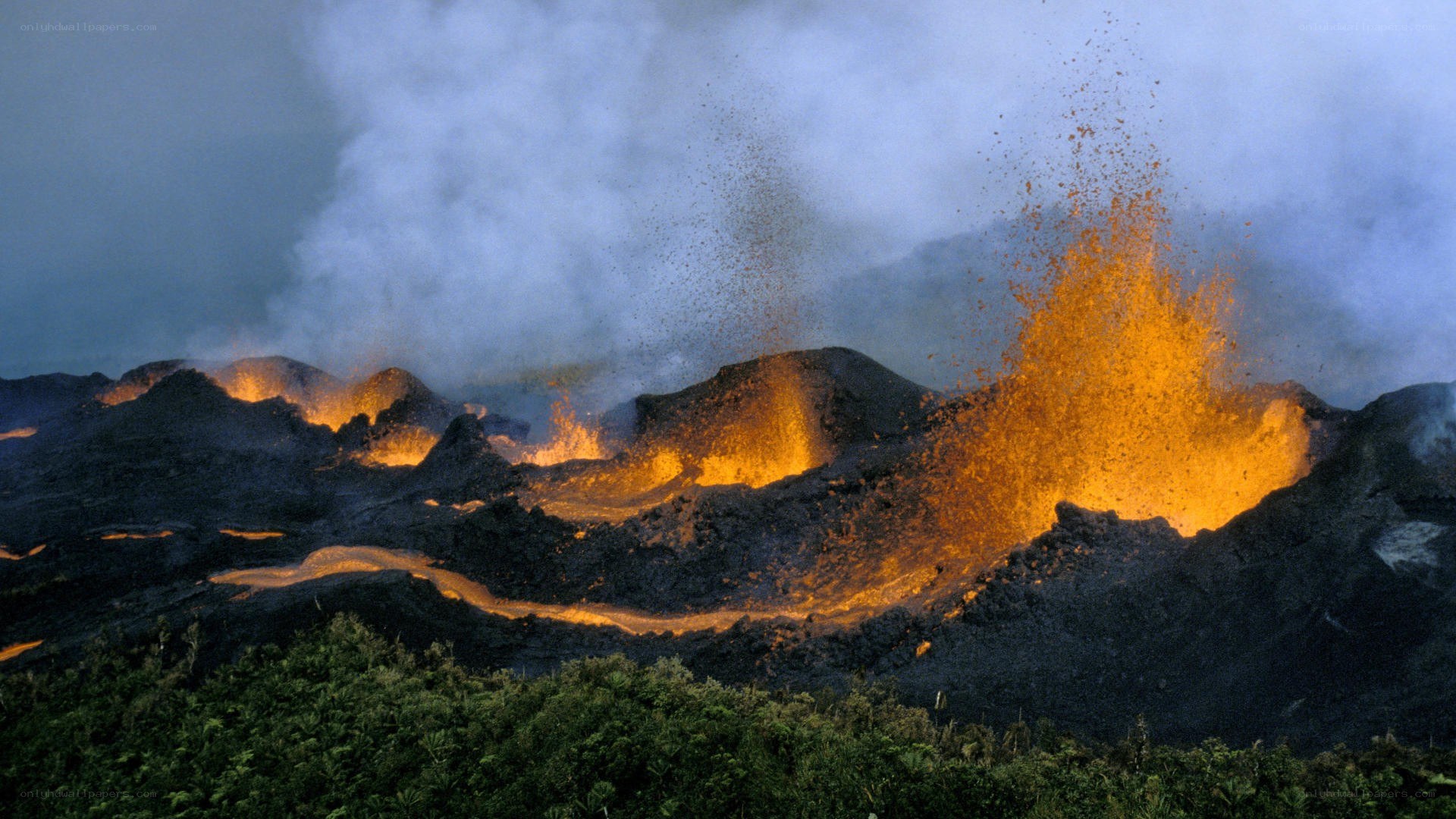 Volcano erupting at night