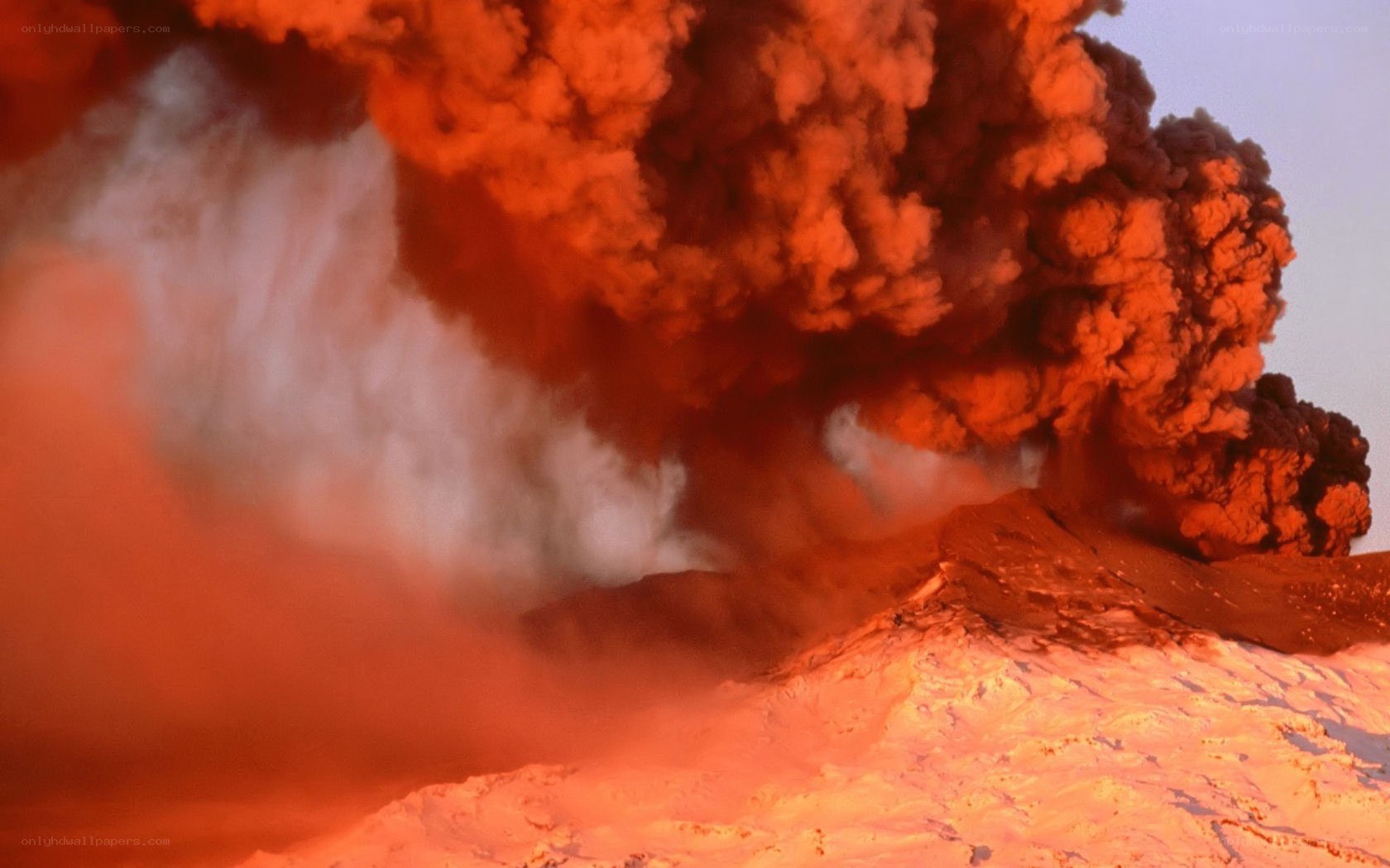 Volcano erupting at night