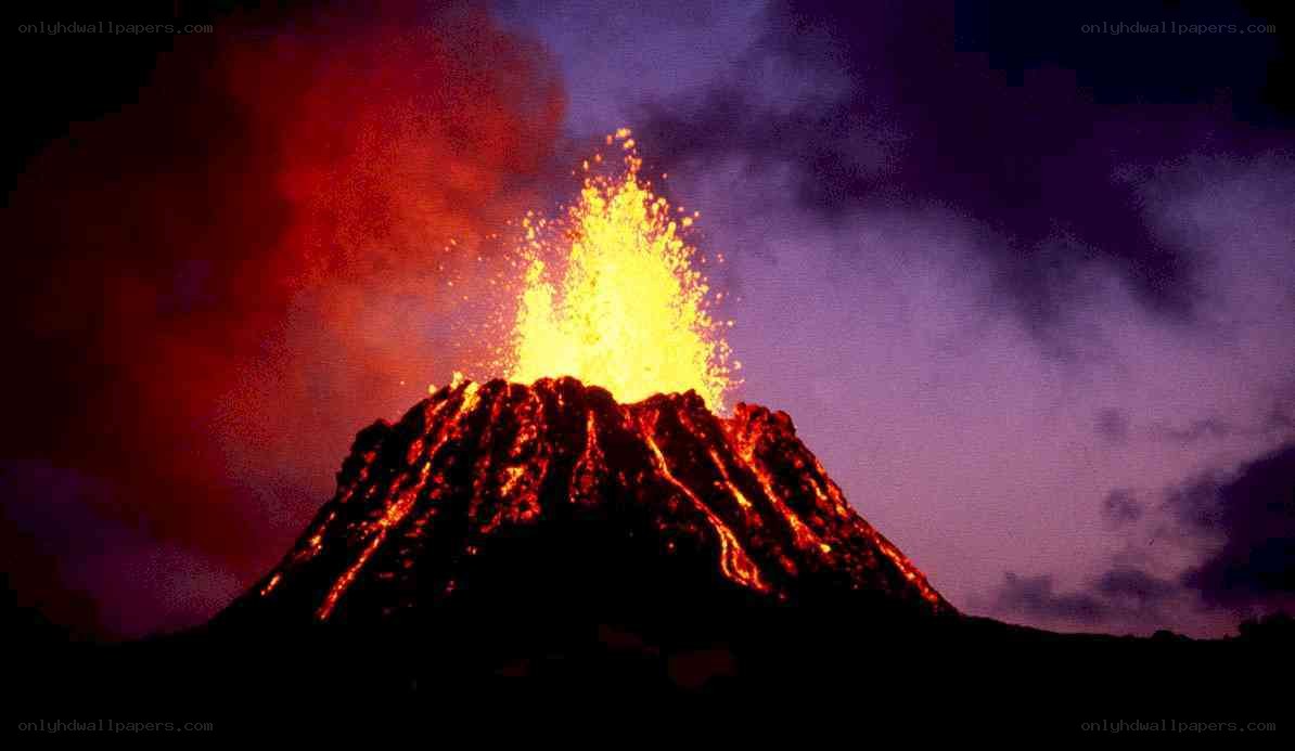 Volcano erupting at night