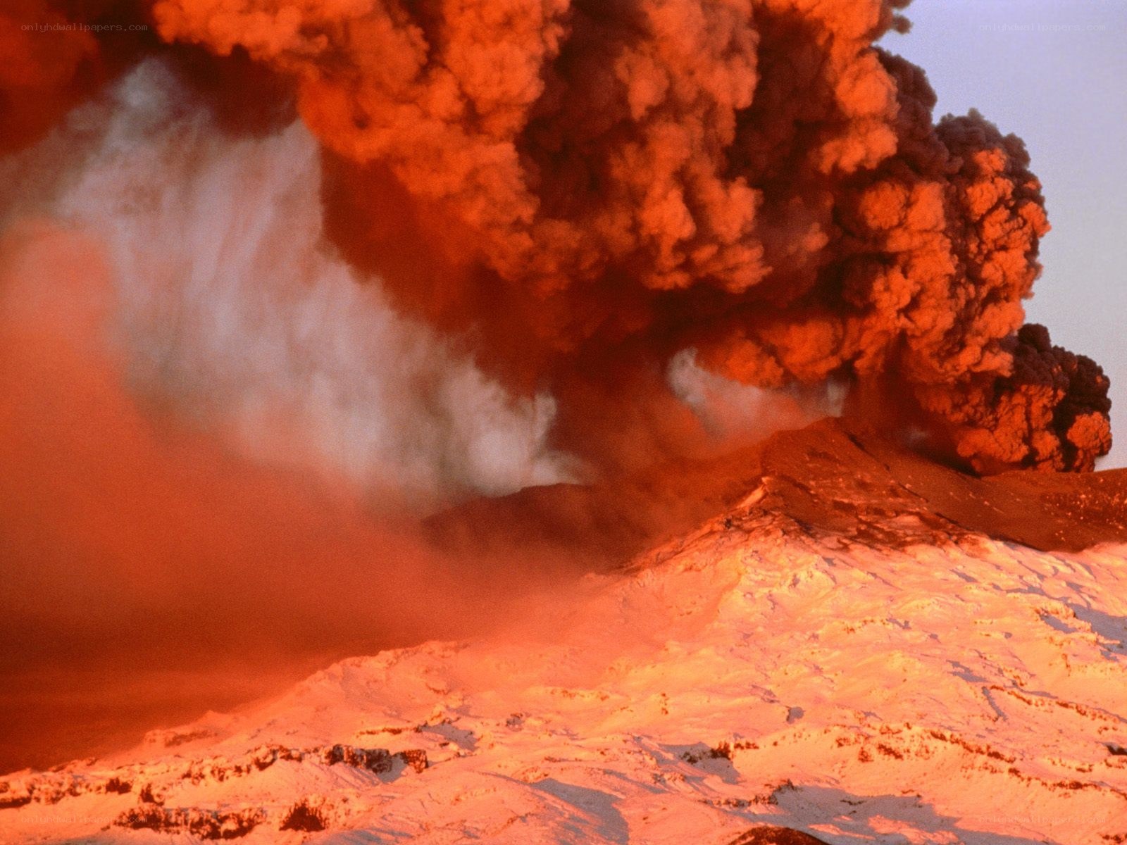 Volcano erupting at night