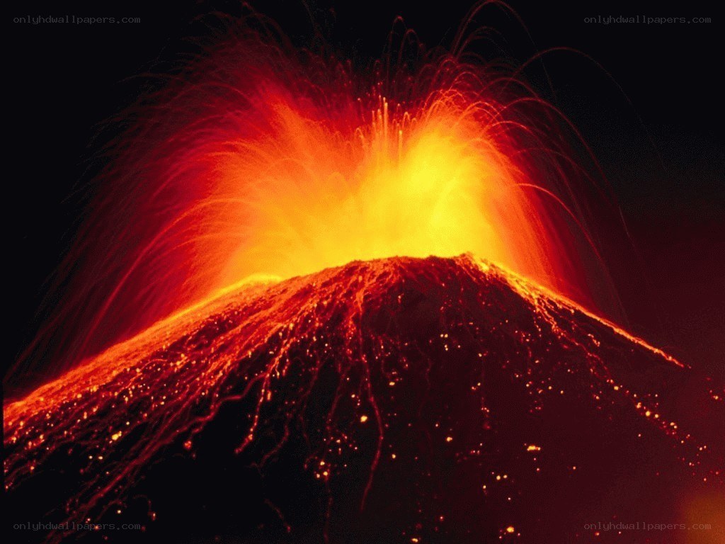 Volcano erupting at night