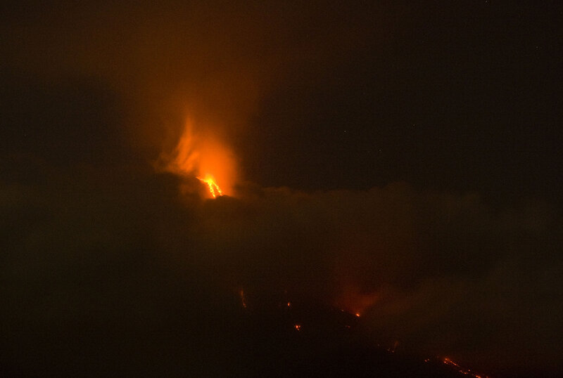 Volcano erupting at night