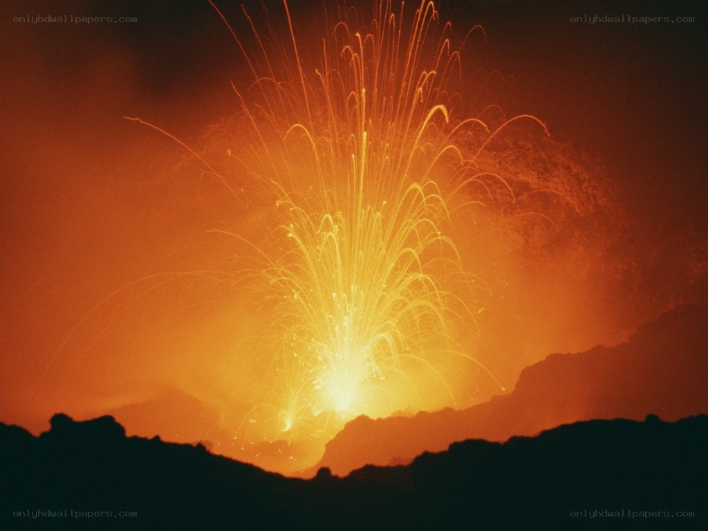 Volcano erupting at night