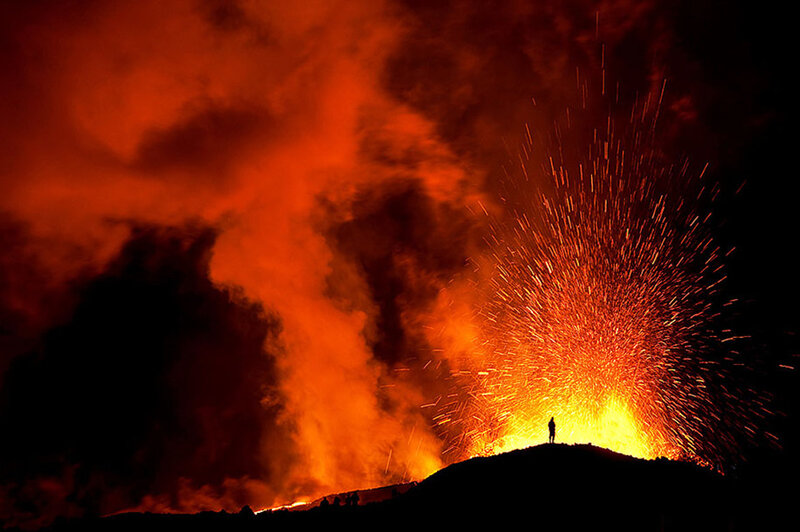 Volcano Erupting at Night — Red, Dramatic, Photograph, Person