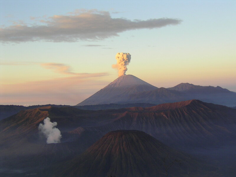 Volcano erupting at sunrise