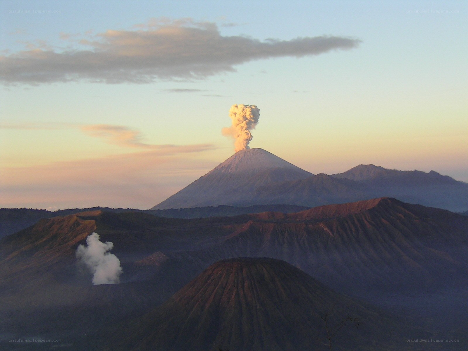 Volcano erupting at sunrise