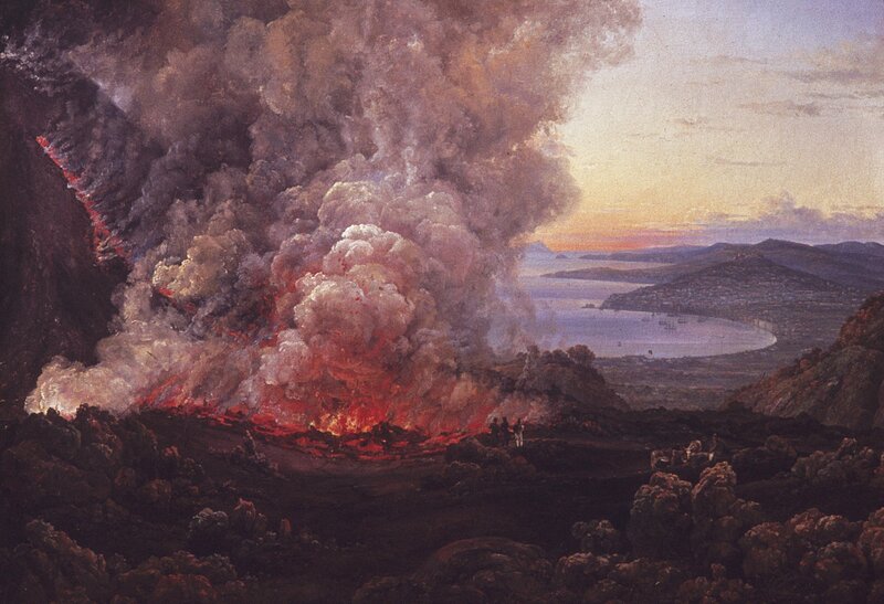 Volcano erupting at sunset