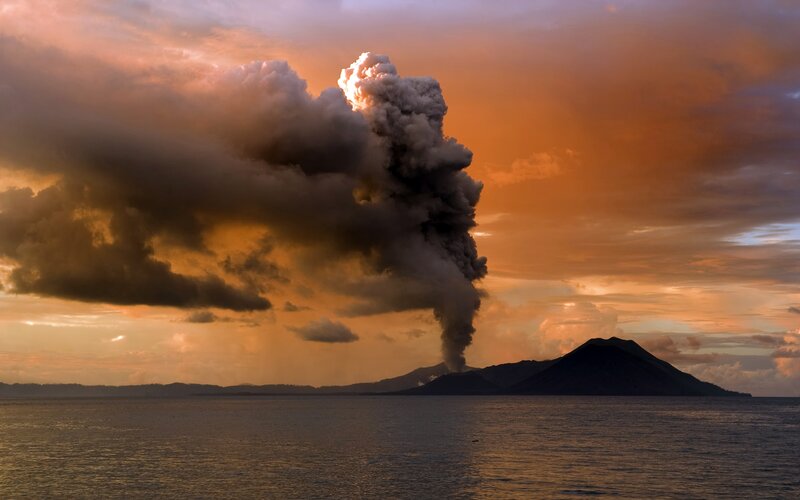Volcano Erupting at Sunset — Orange, Dramatic, Photograph, Clouds