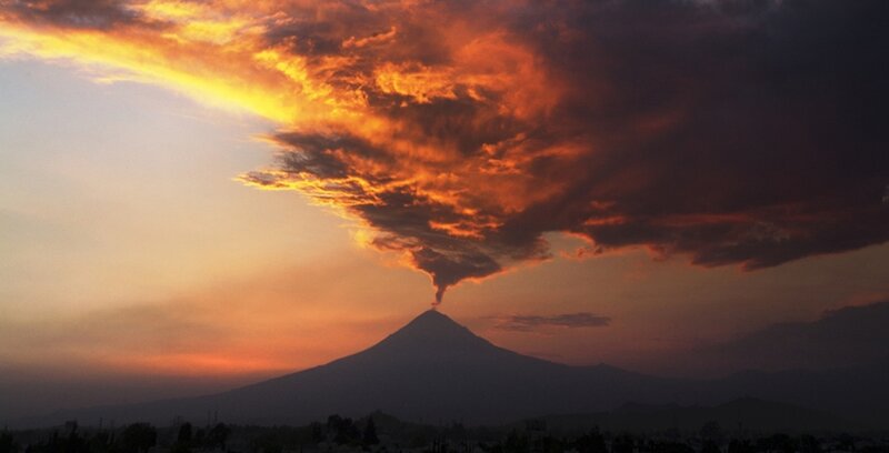 Volcano Erupting at Sunset — Orange, Dramatic