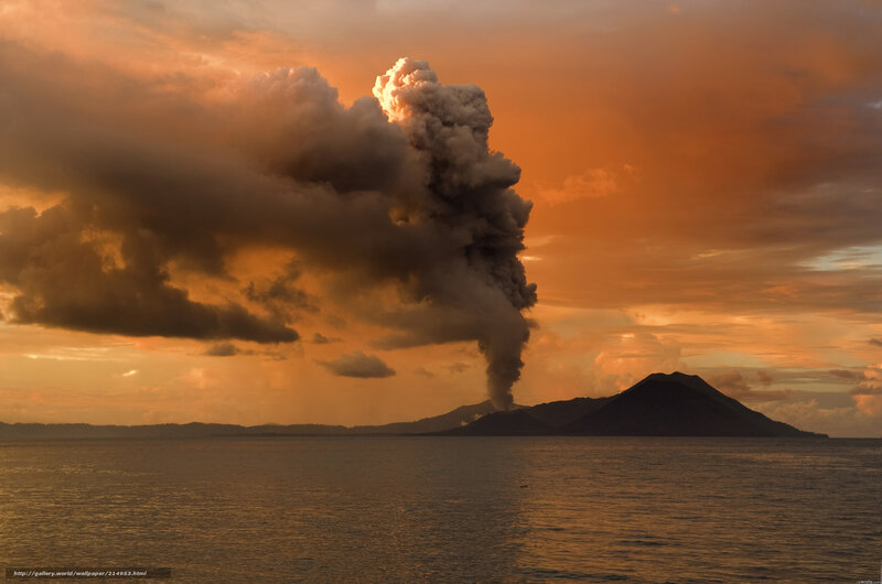 Volcano erupting at sunset