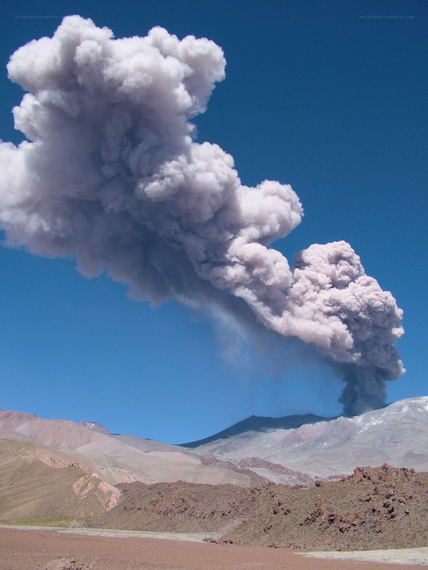 Volcano erupting in desert