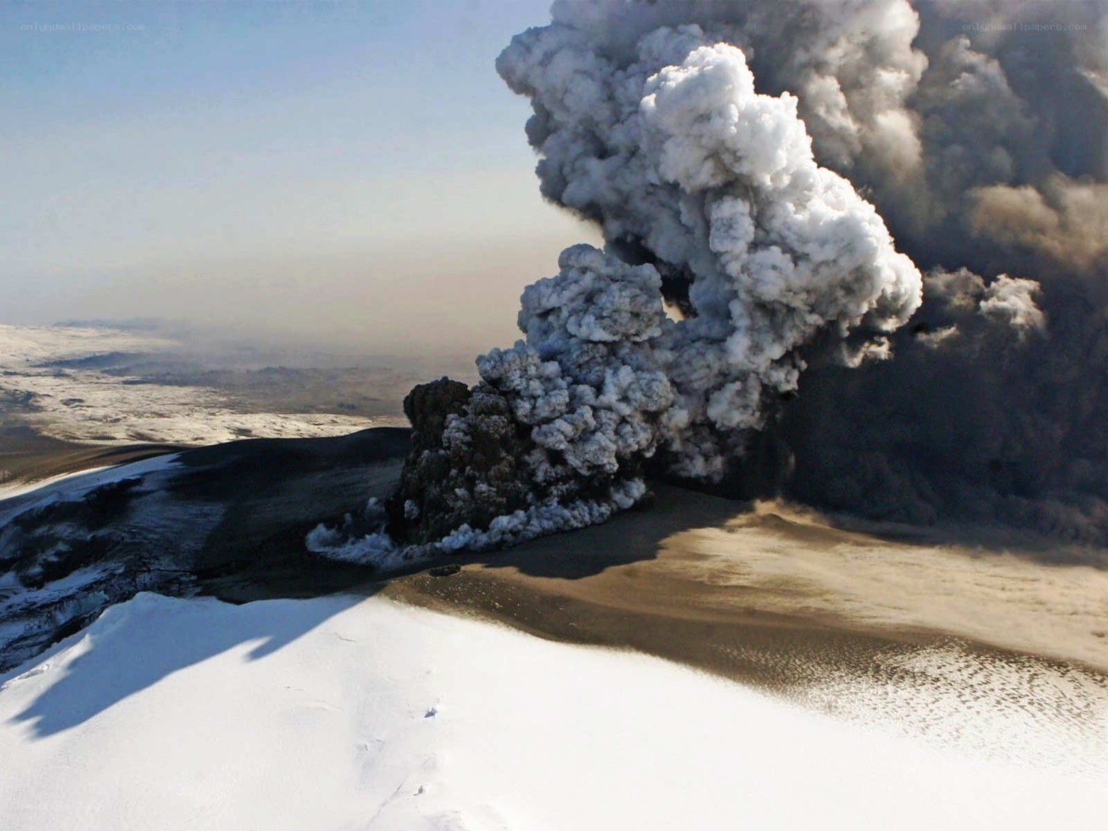 Volcano erupting in snow