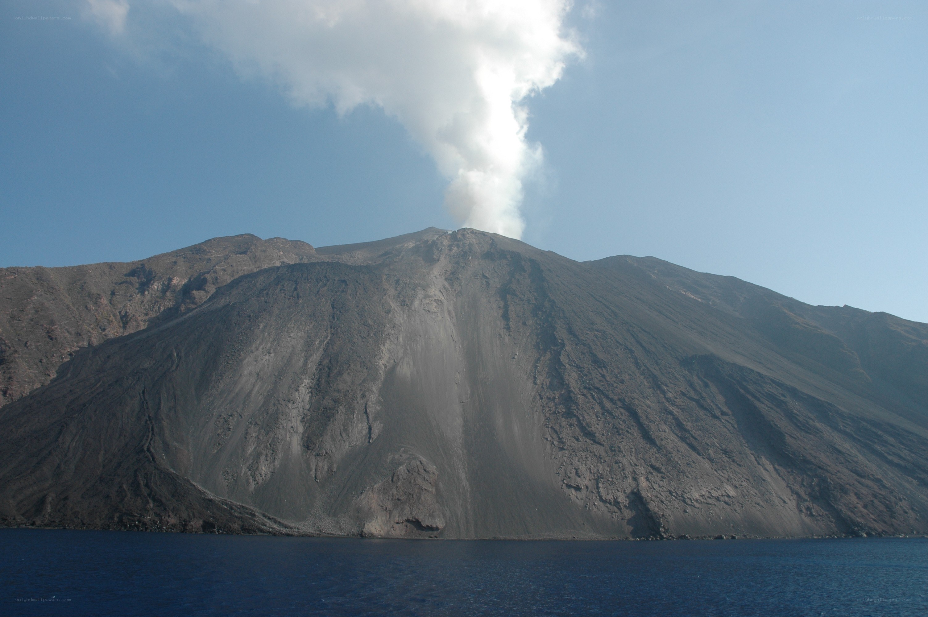 Volcano erupting into the sea