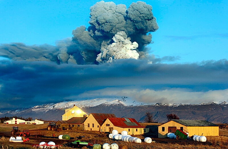 Volcano erupting near farm