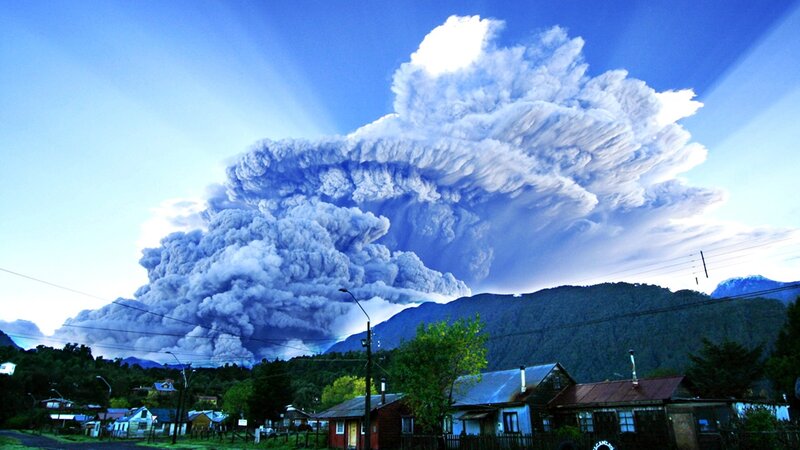 Volcano erupting near town