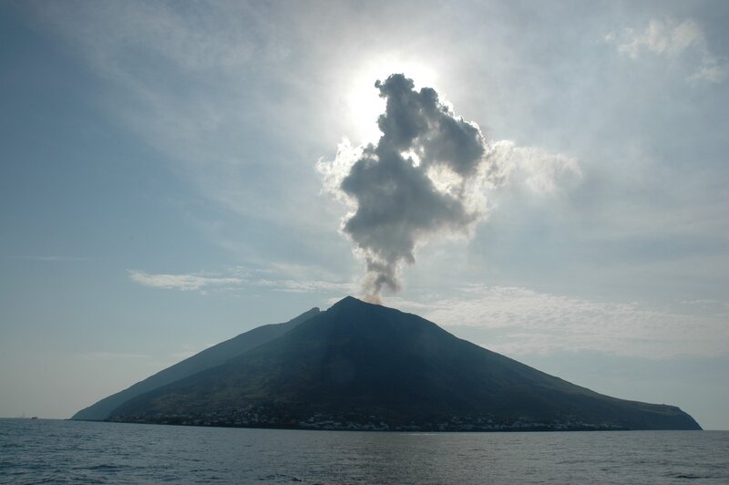 Volcano erupting on an island